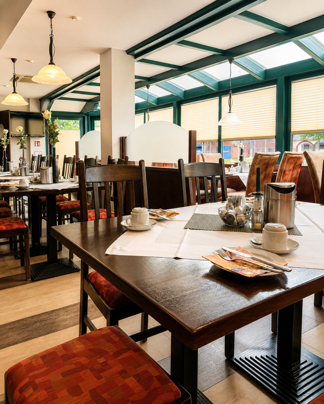 Bright and welcoming breakfast room at City Hotel Friesoythe