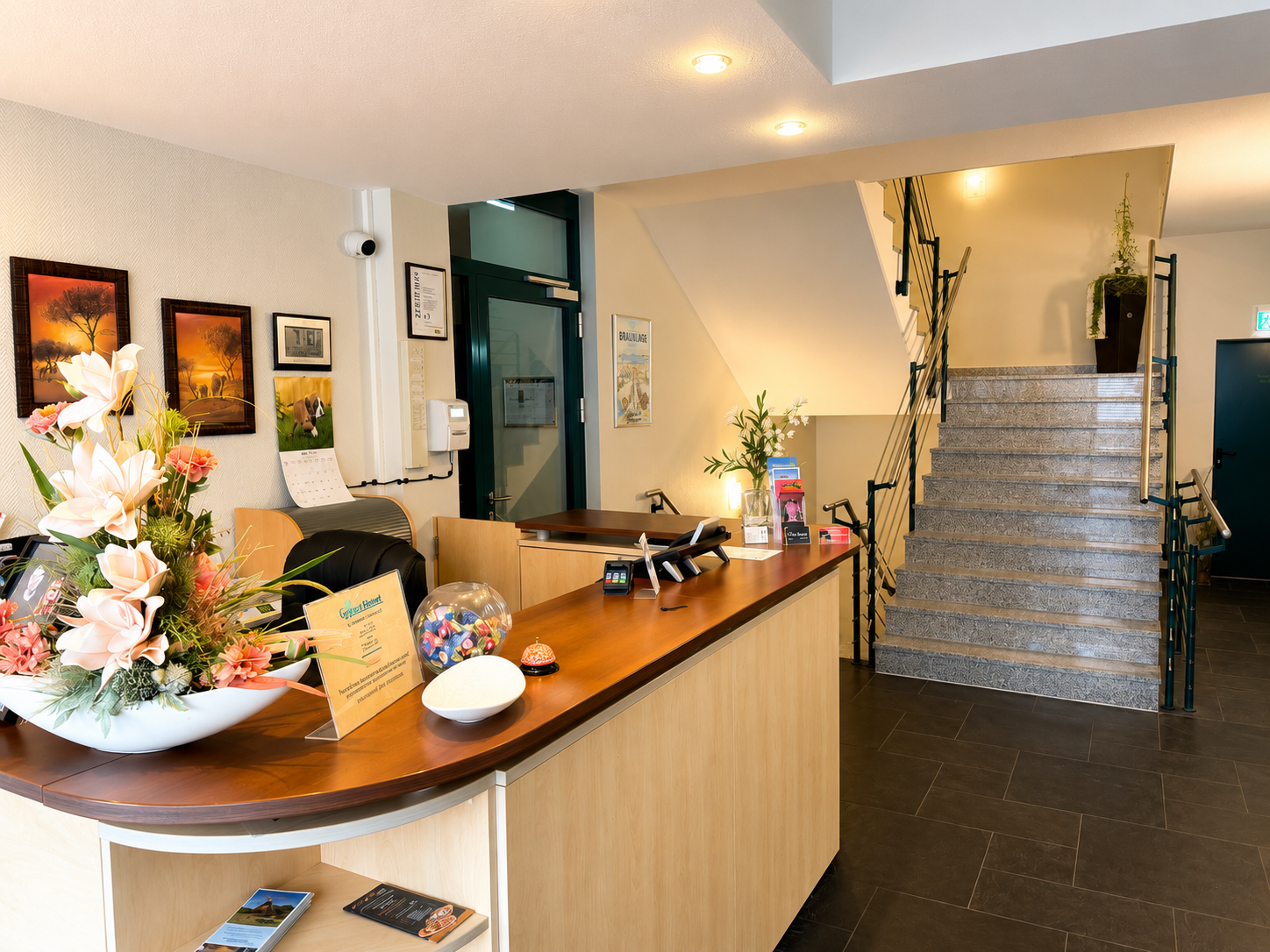 Bright and welcoming lobby with reception at City Hotel Friesoythe